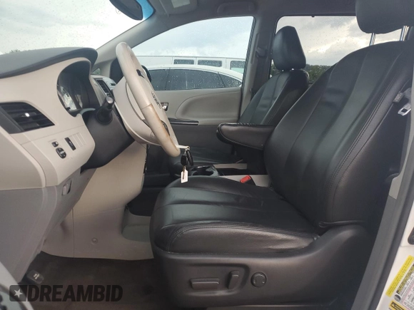 2013 Toyota Sienna SE with VIN 5TDXK3DC5DS332680, listed as a Copart auction lot 62996265 with 185,332 mi miles and Clean title. Bid and sale history available at DreamBid. Image 7.