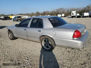 2004 Ford Crown Victoria LX with VIN 2FDFP74W74X150801, listed as a Copart auction lot 43869115 with 138,243 mi miles and Salvage Title. Bid and sale history available at carsss.com. Image 2.