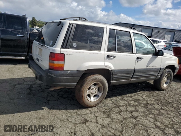 1997 Jeep Grand Cherokee Laredo with VIN 1J4GZ58S8VC647415, listed as a Copart auction lot 49258934 with 0 mi miles and Salvage Title. Bid and sale history available at carsss.com. Image 3.
