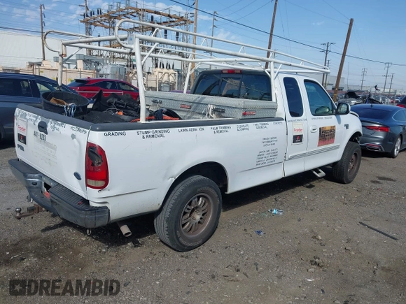 2002 Ford F-150 XL with VIN 1FTRX17L82NA54581, listed as a IAAI auction lot 41698662 with 220,321 mi miles. Bid and sale history available at carsss.com. Image 4.