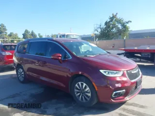 2021 Chrysler Pacifica Hybrid Touring L with VIN 2C4RC1L76MR581285, listed as a IAAI auction lot 42303222 with 77,808 mi miles and . Bid and sale history available at DreamBid. Image 6.