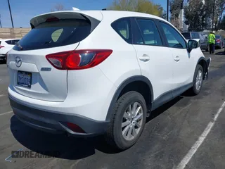 2016 Mazda CX-5 Sport with VIN JM3KE2BY9G0825285, listed as a IAAI auction lot 41841833 with 96,915 mi miles. Bid and sale history available at carsss.com. Image 4.
