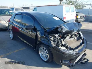 2015 Honda Fit LX z VIN 3HGGK5H57FM717203, wystawiony jako IAAI lot #41615075 z przebiegiem 99 933 mil mil oraz . Historia ofert i sprzedaży dostępna na DreamBid. Obrazek 1.