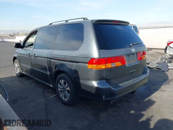 2002 Honda Odyssey EX with VIN 2HKRL18632H512158, listed as a IAAI auction lot 42354621 with 240,373 mi miles and . Bid and sale history available at DreamBid. Image 3.