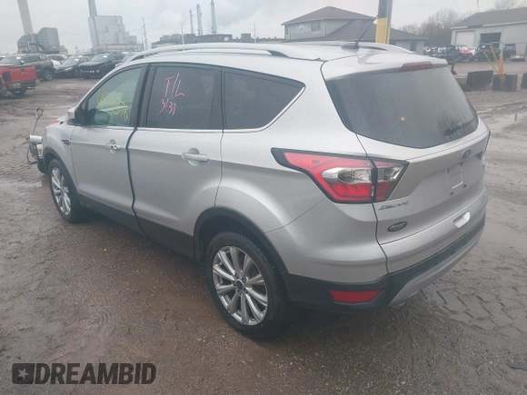 2017 Ford Escape Titanium with VIN 1FMCU0J96HUC21987, listed as a IAAI auction lot 41971376 with 97,488 mi miles and . Bid and sale history available at DreamBid. Image 3.