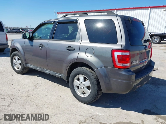 2011 Ford Escape XLT with VIN 1FMCU0D74BKA81385, listed as a IAAI auction lot 41895835 with 238,298 mi miles. Bid and sale history available at carsss.com. Image 3.