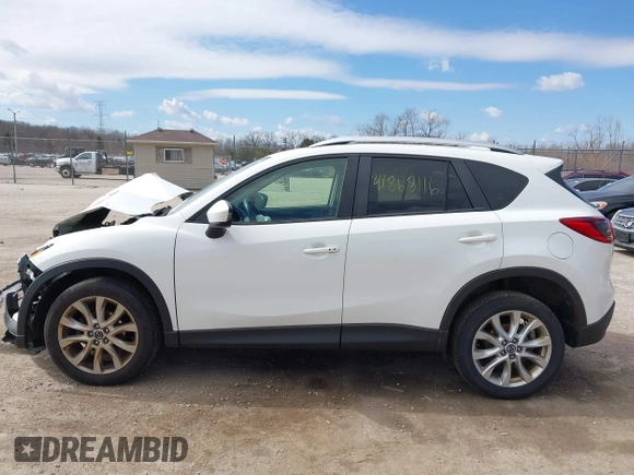 2014 Mazda CX-5 Grand Touring with VIN JM3KE4DY8E0397330, listed as a IAAI auction lot 41868116 with 180,891 mi miles. Bid and sale history available at carsss.com. Image 14.