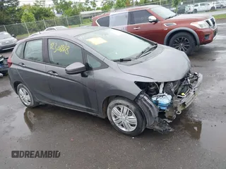 2019 Honda Fit LX z VIN 3HGGK5H40KM735754, wystawiony jako IAAI lot #42308818 z przebiegiem 78 504 mil mil oraz . Historia ofert i sprzedaży dostępna na DreamBid. Obrazek 1.