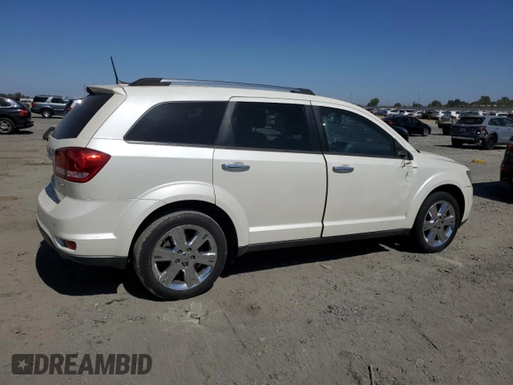 2013 Dodge Journey Crew with VIN 3C4PDCDG5DT668803, listed as a Copart auction lot 61931035 with 121,173 mi miles and Salvage title. Bid and sale history available at DreamBid. Image 3.