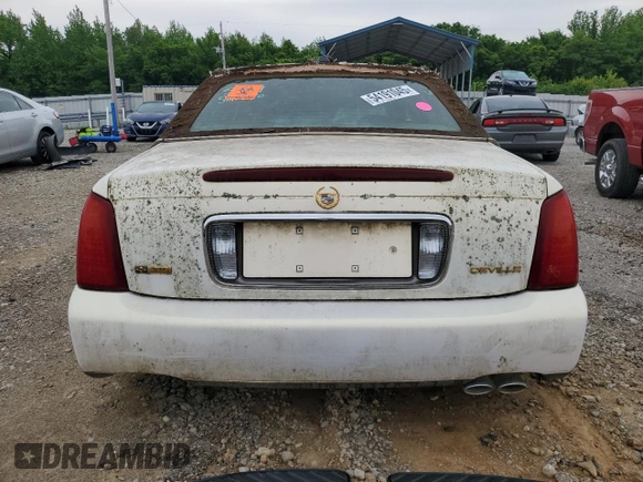 2004 Cadillac DeVille z VIN 1G6KD54Y24U186197, wystawiony jako Copart lot #54191045 z przebiegiem Nie podano mil oraz Szkody całkowita. Historia ofert i sprzedaży dostępna na DreamBid. Obrazek 6.