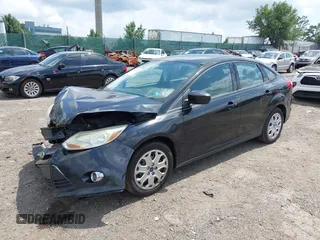 2012 Ford Focus SE z VIN 1FAHP3F26CL157551, wystawiony jako IAAI lot #42697232 z przebiegiem 135 024 mil mil oraz . Historia ofert i sprzedaży dostępna na DreamBid. Obrazek 18.