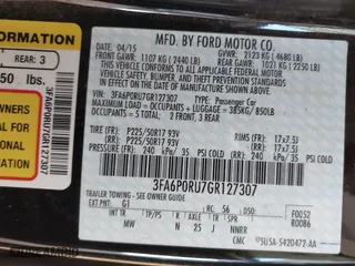 2016 Ford Fusion Titanium Hybrid with VIN 3FA6P0RU7GR127307, listed as a IAAI auction lot 41944427 with 128,076 mi miles. Bid and sale history available at carsss.com. Image 9.