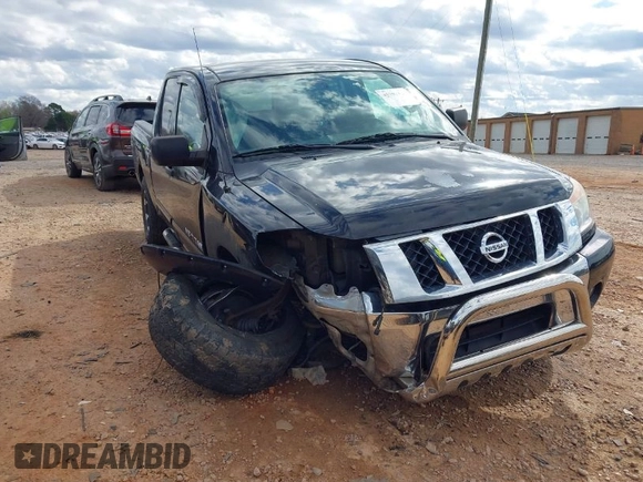 2012 Nissan Titan S with VIN 1N6AA0EC1CN322929, listed as a IAAI auction lot 41792414 with 124,182 mi miles. Bid and sale history available at carsss.com. Image 1.