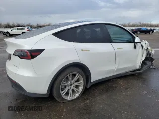 2023 Tesla Model Y Long Range z VIN 7SAYGAEE5PF743079, wystawiony jako Copart lot #45570655 z przebiegiem 46 145 mil mil oraz Szkoda całkowita • Salvage title. Historia ofert i sprzedaży dostępna na DreamBid. Obrazek 3.