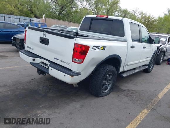 2014 Nissan Titan Pro-4X with VIN 1N6BA0ECXEN501915, listed as a IAAI auction lot 42097967 with 120,851 mi miles and . Bid and sale history available at DreamBid. Image 4.