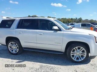 2019 GMC Yukon SLT with VIN 1GKS1BKC9KR332014, listed as a IAAI auction lot 40674460 with 76,545 mi miles. Bid and sale history available at carsss.com. Image 13.
