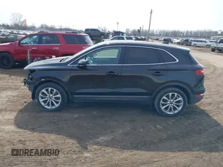 2015 Lincoln MKC with VIN 5LMTJ2AH0FUJ04461, listed as a IAAI auction lot 41804169 with 97,187 mi miles. Bid and sale history available at carsss.com. Image 14.