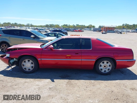 2002 Cadillac Eldorado ESC z VIN 1G6EL12Y72B102153, wystawiony jako IAAI lot #41861541 z przebiegiem 91 273 mil mil oraz . Historia ofert i sprzedaży dostępna na DreamBid. Obrazek 14.