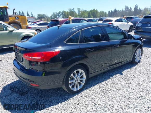 2018 Ford Focus SE z VIN 1FADP3FE5JL279274, wystawiony jako IAAI lot #42626587 z przebiegiem 92 110 mil mil oraz . Historia ofert i sprzedaży dostępna na DreamBid. Obrazek 4.