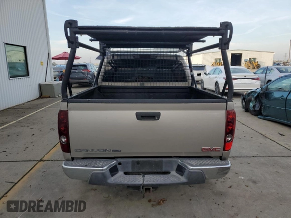 2005 GMC Canyon 1SF SLE Z71 z VIN 1GTDT136658154932, wystawiony jako Copart lot #85556344 z przebiegiem 180 129 mil mil oraz Szkody całkowita. Historia ofert i sprzedaży dostępna na DreamBid. Obrazek 6.