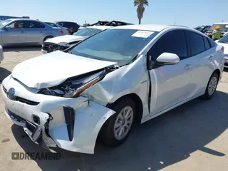 2021 Toyota Prius L Eco with VIN JTDKAMFU8M3135142, listed as a IAAI auction lot 42317007 with 77,353 mi miles and . Bid and sale history available at DreamBid. Image 2.