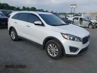 2017 Kia Sorento LX with VIN 5XYPG4A35HG205801, listed as a IAAI auction lot 42143064 with 129,647 mi miles. Bid and sale history available at carsss.com. Image 1.
