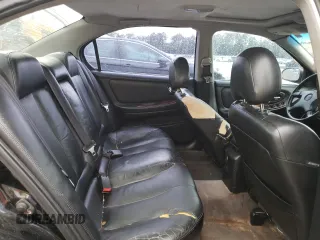 2000 Nissan Maxima GXE z VIN JN1CA31A8YT210913, wystawiony jako Copart lot #56272455 z przebiegiem 281 645 mil mil oraz Nie do naprawy • Non repairable. Historia ofert i sprzedaży dostępna na DreamBid. Obrazek 10.