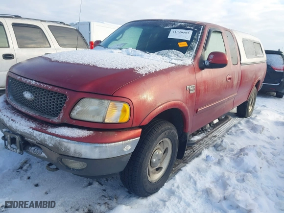 2000 Ford F-150 XL with VIN 1FTRX18WXYNC06121, listed as a IAAI auction lot 41340585 with 74,957 mi miles. Bid and sale history available at carsss.com. Image 2.