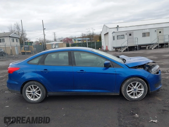 2018 Ford Focus SE z VIN 1FADP3F23JL200674, wystawiony jako IAAI lot #42009238 z przebiegiem 78 007 mil mil oraz . Historia ofert i sprzedaży dostępna na DreamBid. Obrazek 13.