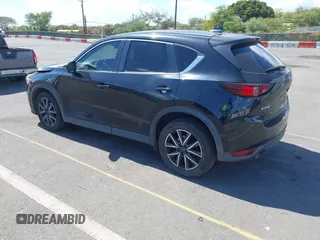 2018 Mazda CX-5 Touring z VIN JM3KFACM5J0309533, wystawiony jako IAAI lot #42195429 z przebiegiem 91 928 mil mil oraz . Historia ofert i sprzedaży dostępna na DreamBid. Obrazek 3.