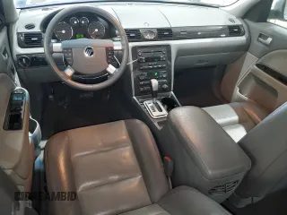 2006 Mercury Montego Premier z VIN 1MEHM42106G604182, wystawiony jako Copart lot #58371085 z przebiegiem 75 013 mil mil oraz Szkody całkowita. Historia ofert i sprzedaży dostępna na DreamBid. Obrazek 8.