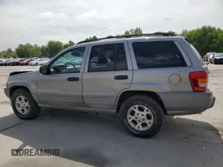 2000 Jeep Grand Cherokee Laredo with VIN 1J4GW48N1YC324356, listed as a Copart auction lot 62011305 with 242,322 mi miles and Salvage title. Bid and sale history available at DreamBid. Image 2.