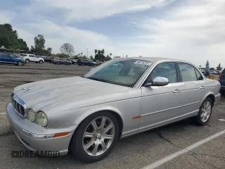 2004 Jaguar XJ Vanden Plas with VIN SAJWA74C04SG25291, listed as a Copart auction lot 56678255 with 176,597 mi miles and Clean Title. Bid and sale history available at DreamBid. Image 1.