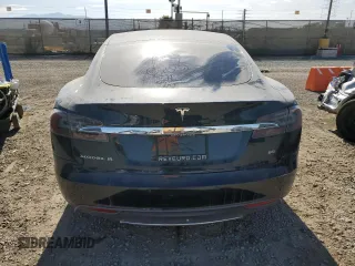 2014 Tesla Model S 60 with VIN 5YJSA1H13EFP38425, listed as a Copart auction lot 63686205 with 183,968 mi miles and Salvage title. Bid and sale history available at DreamBid. Image 6.