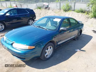 2003 Oldsmobile Alero GL1 z VIN 1G3NL52F53C153441, wystawiony jako IAAI lot #39799738 z przebiegiem 180 025 mil mil oraz . Historia ofert i sprzedaży dostępna na DreamBid. Obrazek 2.