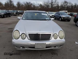 2000 Mercedes-Benz E-Class with VIN WDBJF65J8YB153103, listed as a Copart auction lot 80986234 with 144,205 mi miles and Salvage Title. Bid and sale history available at carsss.com. Image 5.