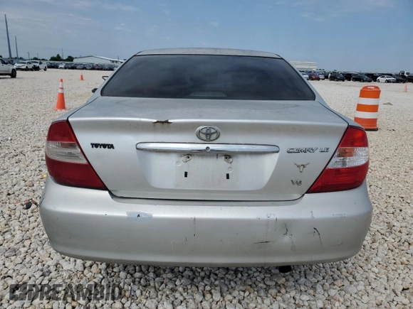 2002 Toyota Camry XLE z VIN 4T1BF32K12U519069, wystawiony jako Copart lot #55501405 z przebiegiem 186 142 mil mil oraz Szkoda całkowita • Salvage title. Historia ofert i sprzedaży dostępna na DreamBid. Obrazek 6.