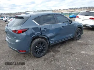 2021 Mazda CX-5 Touring with VIN JM3KFBCM5M0483547, listed as a IAAI auction lot 41683694 with 55,791 mi miles. Bid and sale history available at carsss.com. Image 4.