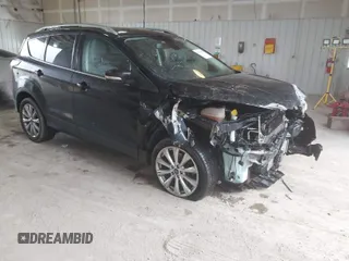 2017 Ford Escape Titanium with VIN 1FMCU0J90HUA59029, listed as a IAAI auction lot 41486836 with 118,979 mi miles. Bid and sale history available at carsss.com. Image 1.