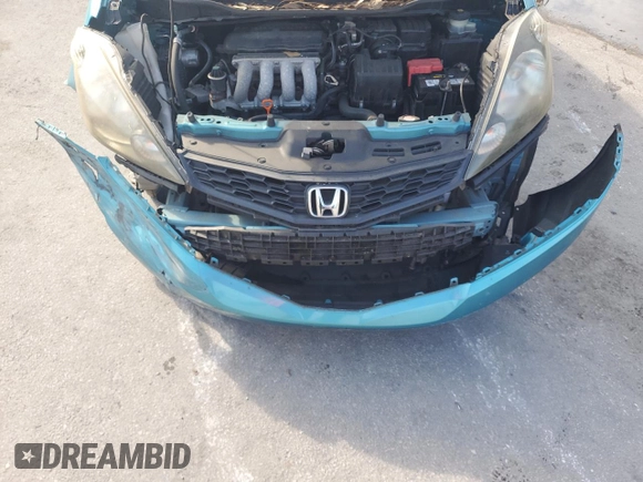 2013 Honda Fit Sport z VIN JHMGE8H50DC006995, wystawiony jako Copart lot #58854875 z przebiegiem 78 207 mil mil oraz Szkoda całkowita • Salvage title. Historia ofert i sprzedaży dostępna na DreamBid. Obrazek 12.