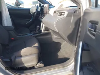 2023 Toyota Corolla Cross Hybrid S with VIN 7MUFBABG8PV011345, listed as a IAAI auction lot 41286619 with 13,518 mi miles and . Bid and sale history available at DreamBid. Image 5.