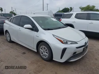 2021 Toyota Prius L Eco z VIN JTDKAMFU5M3132103, wystawiony jako IAAI lot #42061511 z przebiegiem 42 116 mil mil oraz . Historia ofert i sprzedaży dostępna na DreamBid. Obrazek 1.
