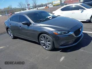 2020 Mazda 6 Grand Touring with VIN JM1GL1TY0L1522025, listed as a IAAI auction lot 41876429 with 68,101 mi miles and . Bid and sale history available at DreamBid. Image 1.