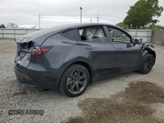 2024 Tesla Model Y z VIN 7SAYGDED4RF103411, wystawiony jako Copart lot #59982815 z przebiegiem 17 601 mil mil oraz Szkoda całkowita • Salvage title. Historia ofert i sprzedaży dostępna na DreamBid. Obrazek 3.