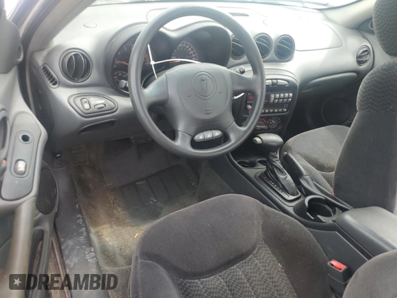 2001 Pontiac Grand Am with VIN 1G2NE12TX1M668035, listed as a Copart auction lot 59700585 with 60,965 mi miles and Salvage title. Bid and sale history available at DreamBid. Image 8.