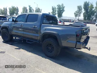2021 Toyota Tacoma SR z VIN 5TFCZ5AN1MX274315, wystawiony jako IAAI lot #42273054 z przebiegiem 67 863 mil mil oraz . Historia ofert i sprzedaży dostępna na DreamBid. Obrazek 3.