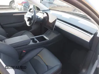 2023 Tesla Model Y Performance with VIN 7SAYGDEF5PF823122, listed as a IAAI auction lot 41546480 with 12,943 mi miles and . Bid and sale history available at DreamBid. Image 5.