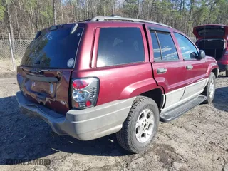 1999 Jeep Grand Cherokee Laredo with VIN 1J4GW58S5XC781472, listed as a IAAI auction lot 41738515 with 216,000 mi miles. Bid and sale history available at carsss.com. Image 4.