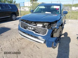 2025 Kia Telluride S with VIN 5XYP64GCXSG587826, listed as a IAAI auction lot 42065749 with 1,864 mi miles and . Bid and sale history available at DreamBid. Image 6.
