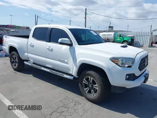 2018 Toyota Tacoma SR5 with VIN 3TMBZ5DN7JM014977, listed as a IAAI auction lot 42136367 with 83,964 mi miles and . Bid and sale history available at DreamBid. Image 1.
